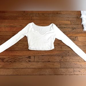 super cute white long sleeve crop top from edikted